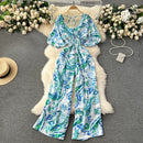 Macacão Feminino Floral com Decote V, Mangas Dolman e Cintura Ajustada – Elegância e Conforto