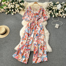 Macacão Feminino Floral com Decote V, Mangas Dolman e Cintura Ajustada – Elegância e Conforto