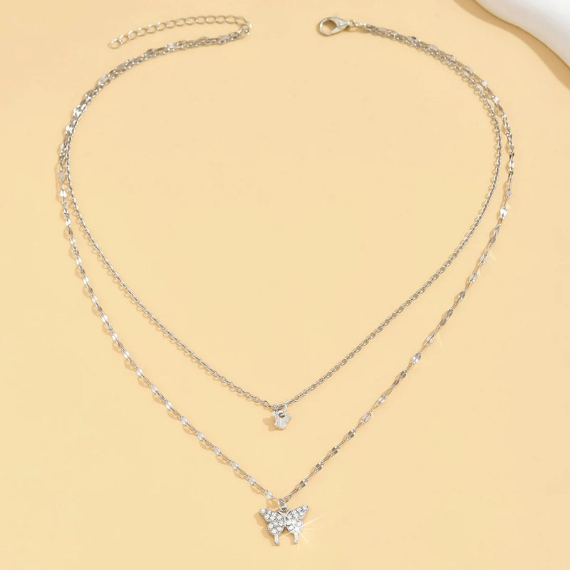 Colar Duplo Borboleta Brilhante – Elegância Feminina para Festas e Presentes
